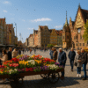 Wrocław Market Square in May with people, colorful flower cart and historic buildings in the background