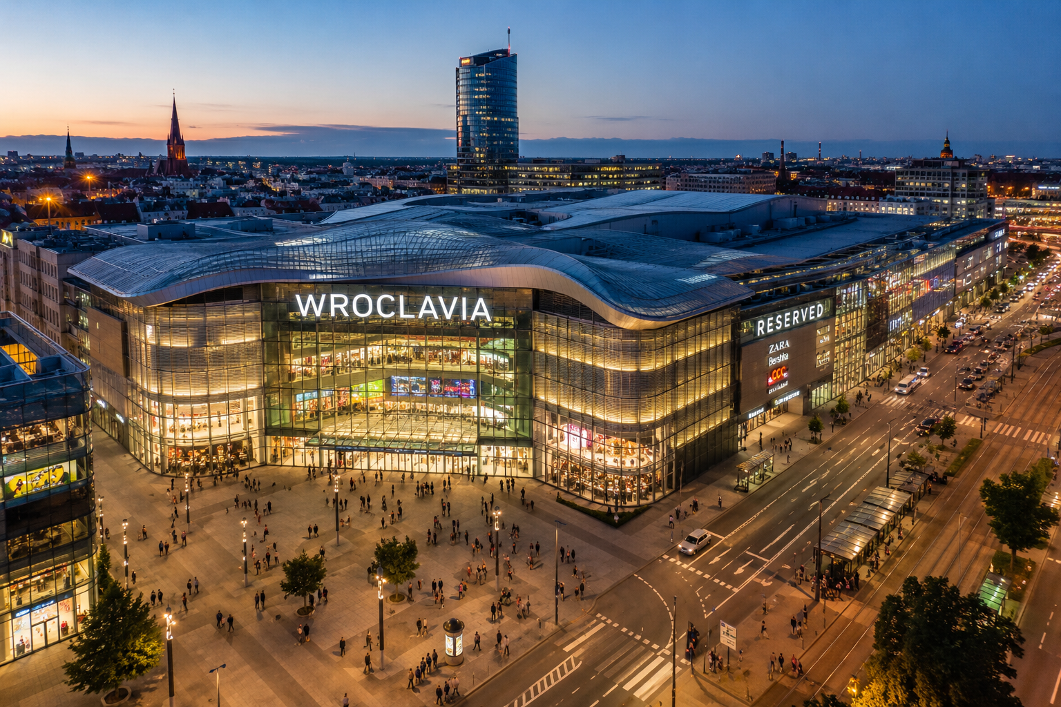 Best shopping malls in Wrocław with a modern shopping center and city skyline at dusk
