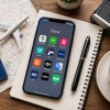 Traveler planning a European city trip using travel apps on a smartphone with a passport, map and camera